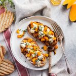 baked-pumpkin-sandwich-with-dorblu-cheese-with-blue-mold-honey-thyme-concrete-old-light-background-top-view_253362-11688